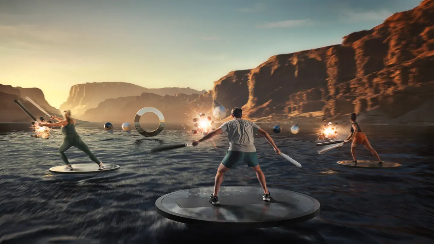 Members working out together on floating platforms in a canyon